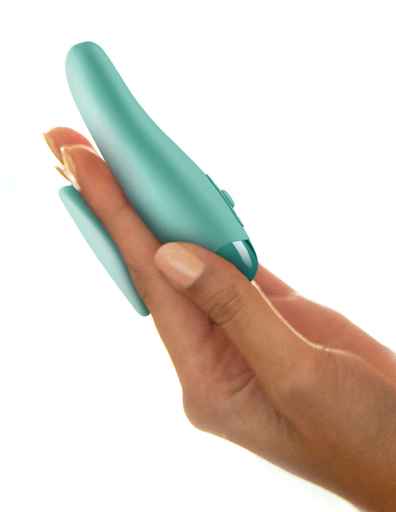 Close-up of hand holding green JimmyJane Form 2 Gripp 2 Prong Vibrator, showcasing ergonomic design for easy maneuverability and pleasure.