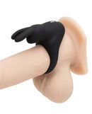 Happy Rabbit Cock Ring Black on realistic model, featuring bunny ears and stretchy design for enhanced pleasure.
