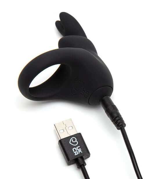Happy Rabbit Rechargeable Rabbit Cock Ring in black with USB charging cable for enhanced pleasure and powerful vibrations.