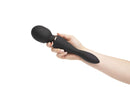 Hand holding Nu Sensuelle Alluvion Wand Black with dual ends for clitoral, G-Spot, and anal stimulation with two powerful motors.