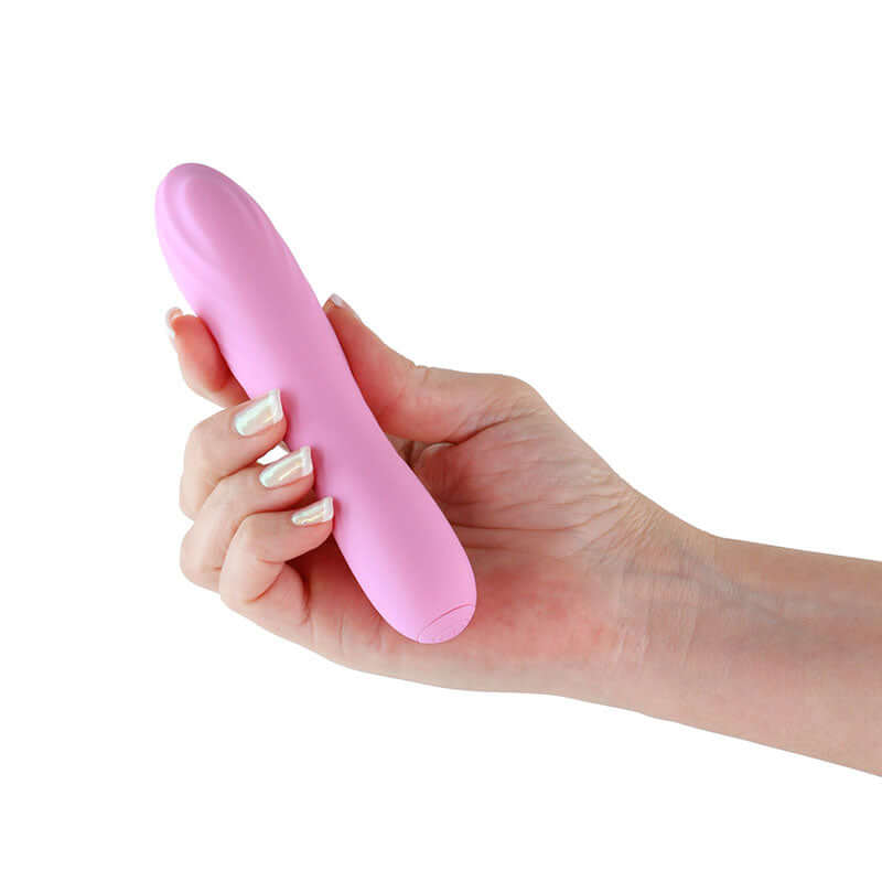 Hand holding pink Desire Destiny Azalea Dildo from NS Novelties' series, a sleek and lightweight anal toy for enhanced pleasure.