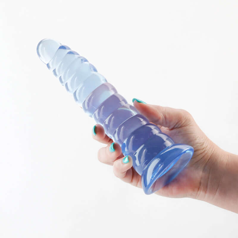 Holding Fantasia Nymph Blue Fantasy Dildo by NS Novelties showing its ergonomic design and flexible structure for luxurious pleasure