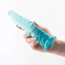 Hand holding the Fantasia Nymph Teal Fantasy Dildo by NS Novelties, showcasing its luxurious and stimulating design.