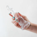 Hand holding the Fantasia Siren Clear Dildo, renowned for luxurious pleasure and performance excellence by NS Novelties.
