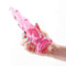 Pink Fantasia Siren Dildo with spiral design being held by hand, luxurious and flexible for ultimate pleasure