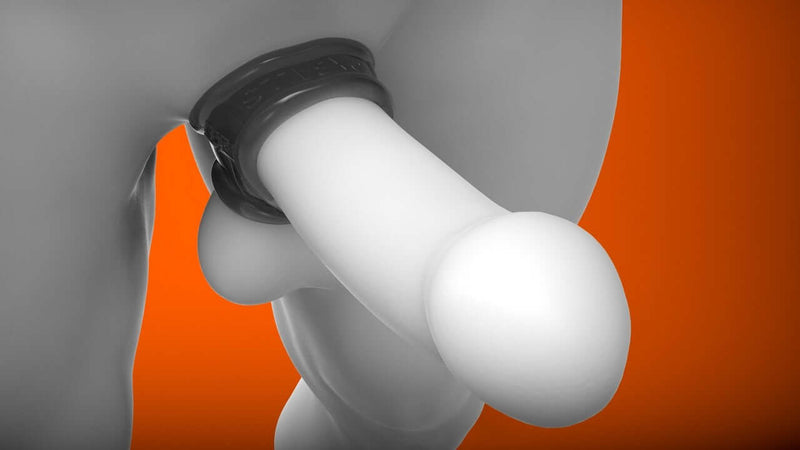 Oxballs Cocksling 2 Smoke erection-enhancing cock ring in use on mannequin for a bigger, harder bulge against orange background