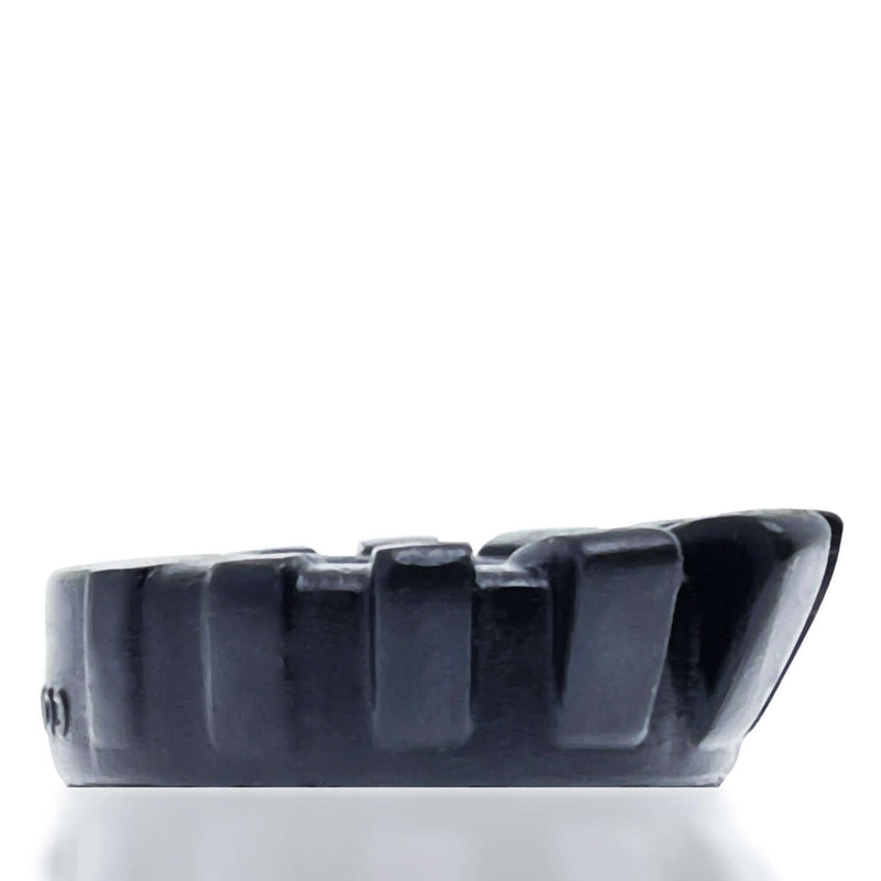 Side view of the black Oxballs Cock Lug ring, showcasing its silicone material and textured lugs.