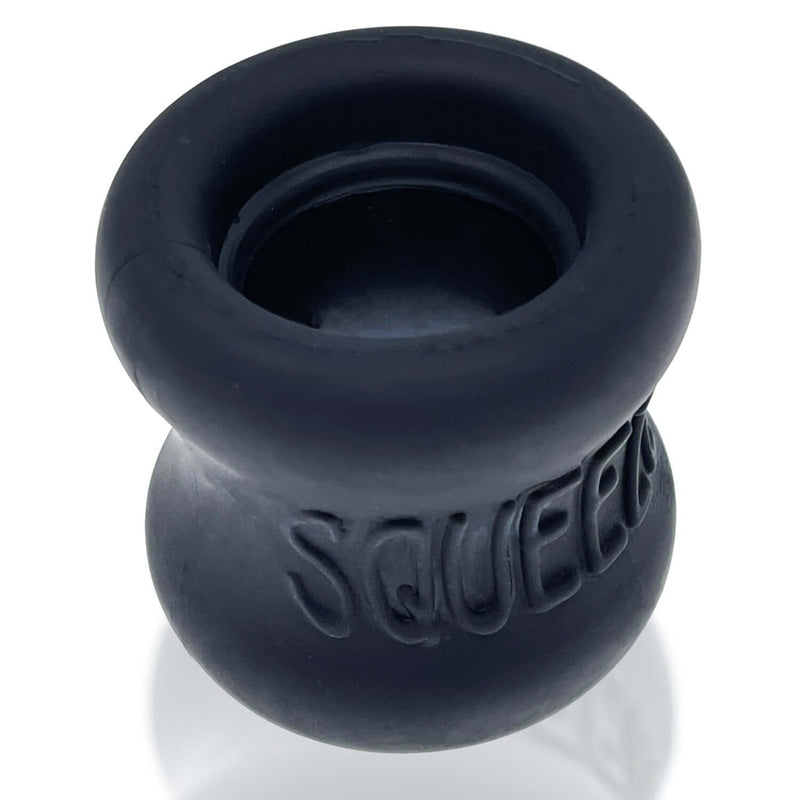 Oxballs Squeeze Ball Stretcher Night in black, hour glass shape, soft FlexTPR material, ergonomic design for comfortable wear.
