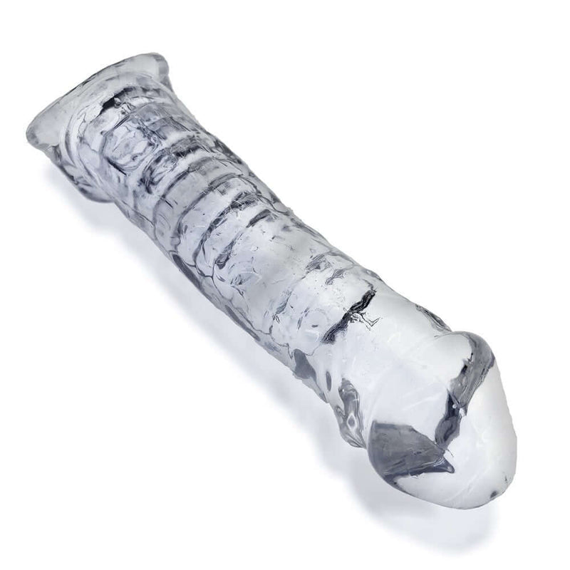 Oxballs Muscle Bandit Cocksheath in clear color showcasing its textured design for enhancing length and thickness.