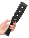 Hand holding Fetish Fantasy Rubber Paddle by Pipedream Products for BDSM play, bendable rubber, textured surface, soft yet firm.