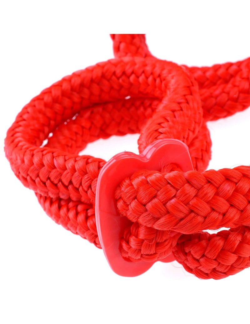 Red Fetish Fantasy Silk Rope Love Cuffs for Japanese bondage beginners, close-up on braided red silk rope with plastic buckle.