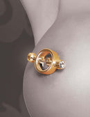 Luxurious gold magnetic nipple clamp on skin, featuring high-quality design and hygienic nonporous finish for enhanced pleasure.
