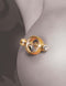 Luxurious gold magnetic nipple clamp on skin, featuring high-quality design and hygienic nonporous finish for enhanced pleasure.