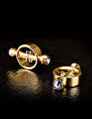 Luxurious Fetish Fantasy Gold Magnetic Nipple Clamps in high-quality metal with sleek, nonporous finish on black background.