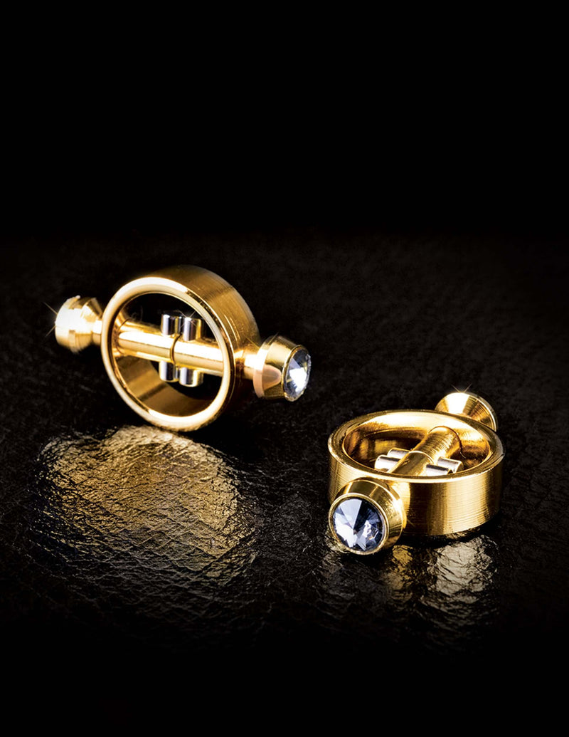 Luxurious Fetish Fantasy Gold Magnetic Nipple Clamps in high-quality metal with sleek, nonporous finish on black background.