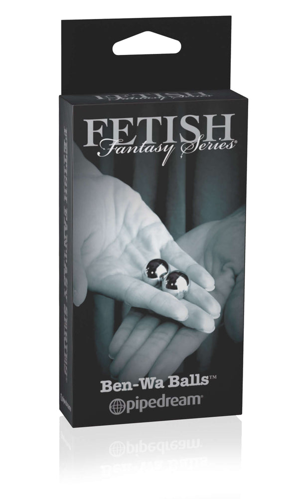 Fetish Fantasy Series Limited Edition Ben Wa Balls Gold packaging with hands holding the balls.