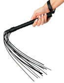 Hand holding Fetish Fantasy Limited Edition Deluxe Cat O Nine black whip with solid handle and multiple tresses for BDSM play.
