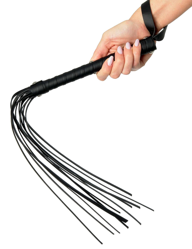 Hand holding Fetish Fantasy Limited Edition Deluxe Cat O Nine black whip with solid handle and multiple tresses for BDSM play.