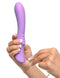 Woman holding and charging the Fantasy For Her Flexible Please Her Purple Vibrator from Pipedream Products.