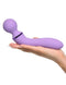 Purple Fantasy For Her Duo Wand intimate massager held in hand, featuring dual motors for versatile pleasure and powerful vibrations.