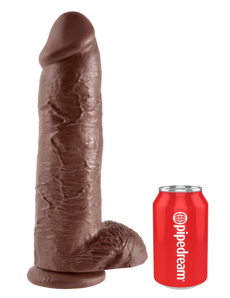King Cock 12-inch brown dildo with balls next to a red can for size comparison