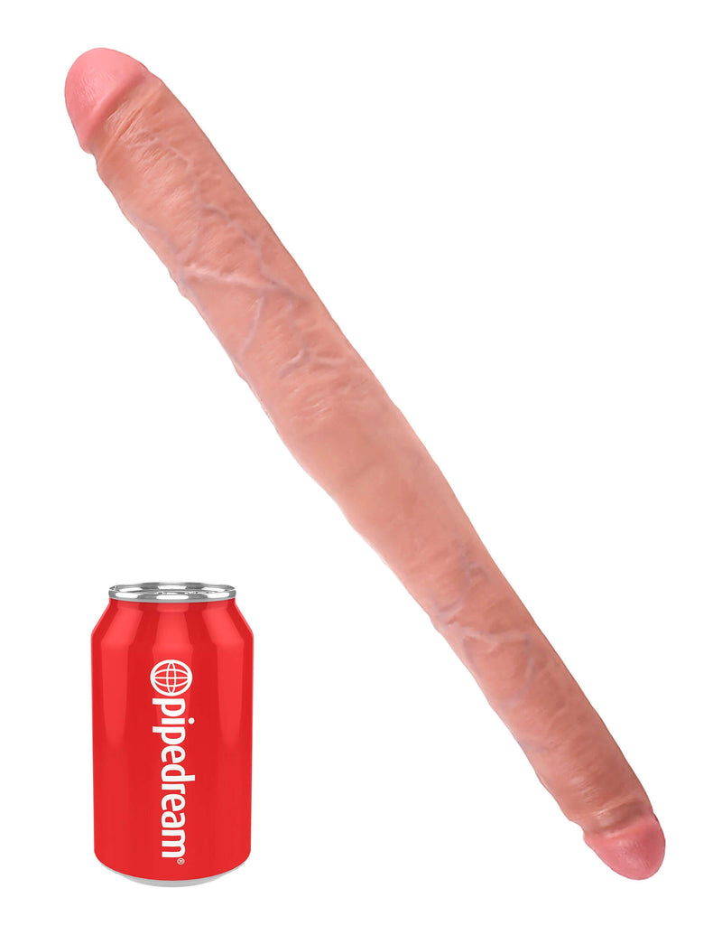 King Cock 16-inch tapered double dildo in flesh beige color next to a red Pipedream can for size comparison.