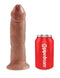 King Cock 9-Inch Tan Dildo by Pipedream Products beside a red Pipedream soda can for size comparison