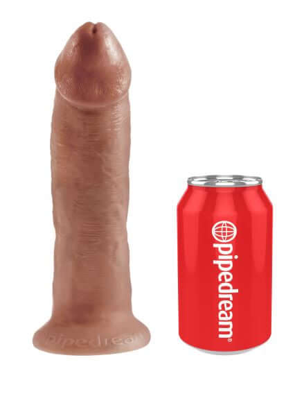 King Cock 9-Inch Tan Dildo by Pipedream Products beside a red Pipedream soda can for size comparison