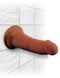King Cock Triple Density 6 inches brown dildo with suction base attached to tiled wall for lifelike pleasure experience