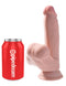 King Cock Triple Density Plus 7-inch dildo with swinging balls next to a Pipedream can for size comparison