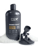PDX Shower Therapy Soothing Scrub Stroker in Brown Skin Tone by Pipedream Products with discreet shampoo bottle design in soapy setting.