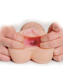 Hands holding PDX F*ck Me Silly To Go Horny F*ckslut Stroker showing its lifelike and textured internal tunnel.