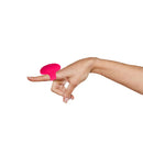 Vibe Lite Ruby rechargeable vibrating finger ring in red, worn on a finger, showcasing its sleek design and 10 speeds of pleasure.