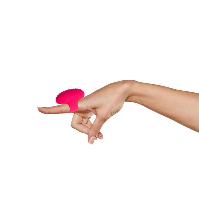 Vibe Lite Ruby rechargeable vibrating finger ring in red, worn on a finger, showcasing its sleek design and 10 speeds of pleasure.