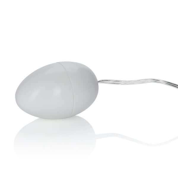 Compact ivory egg vibrator with cable, versatile and phthalate-free for safe pleasure, made from durable ABS plastic.
