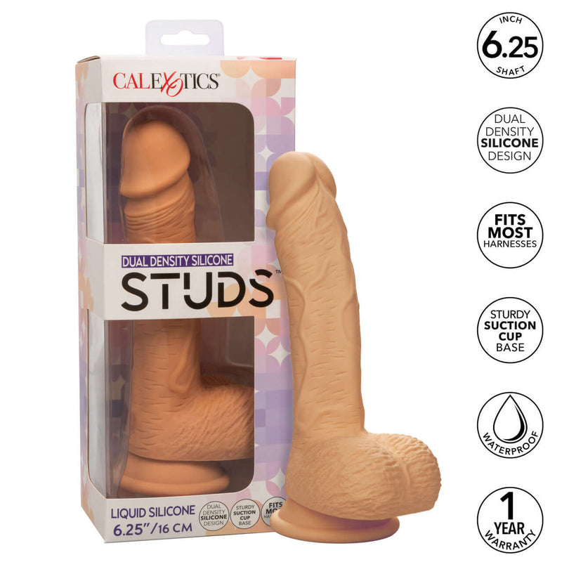 Dual Density Silicone Stud 6.25 inches Ivory Light Skin Tone Dildo in box with features listed: 6.25" shaft, dual density silicone, fits most harnesses, suction cup base, waterproof, 1-year warranty.