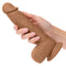 Brown Dual Density Silicone Dildo 6.25 inches with suction cup base held in hand