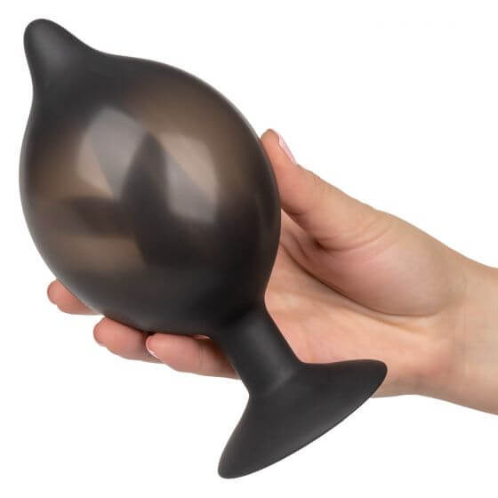 Person holding a Cal Exotics Large Silicone Inflatable Plug for customizable anal pleasure and comfort.