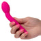 Pink California Exotic Novelties Bliss Liquid Silicone Mini Tulip G-Spot Vibrator held in hand, showcasing its curves and ripples.