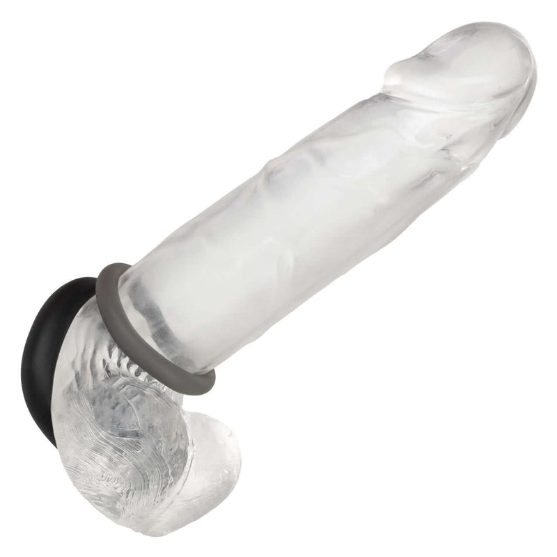 Alpha Liquid Silicone Prolong Set of 2 Rings on a transparent dildo for enhanced intimate pleasure and comfort.