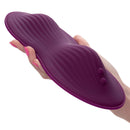 Lust Remote Control Dual Rider Purple Vibrator from California Exotic Novelties held in hand with raised texture and control buttons.