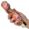 Hand holding the colorful Naughty Bits WTF Wand To Fuck personal massager with flexible head and 10 vibration functions.