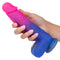 Person holding Naughty Bits Ombre Hombre XL Vibrating Dildo with pink, purple and blue glitter finish from California Exotic Novelties