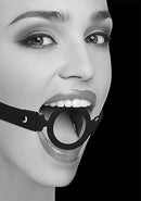 Black and White Silicone Ring Gag with Adjustable Straps worn by a model, showcasing its elegant design and comfort.