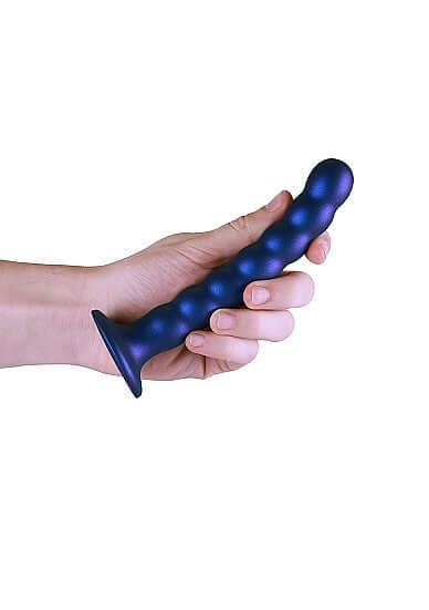 Hand holding Ouch! Beaded Silicone G-Spot Dildo 6.5 inches Metallic Blue with suction cup base.