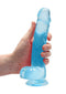 Holding Realrock 8 inches Realistic Dildo with Balls in Blue with suction cup from Shots Toys America.