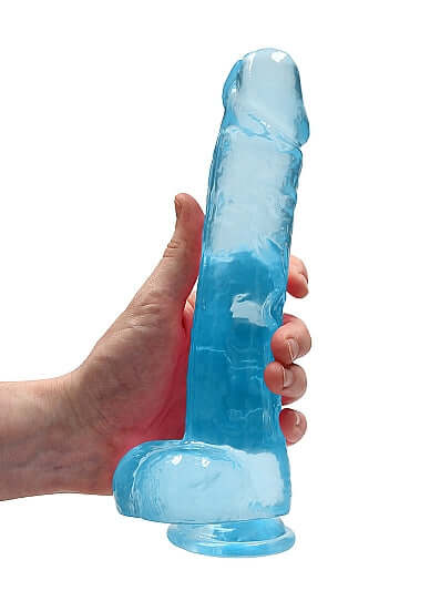 Realrock 9 inches Blue Realistic Dildo with Balls and Sturdy Suction Cup held in hand for versatile play.