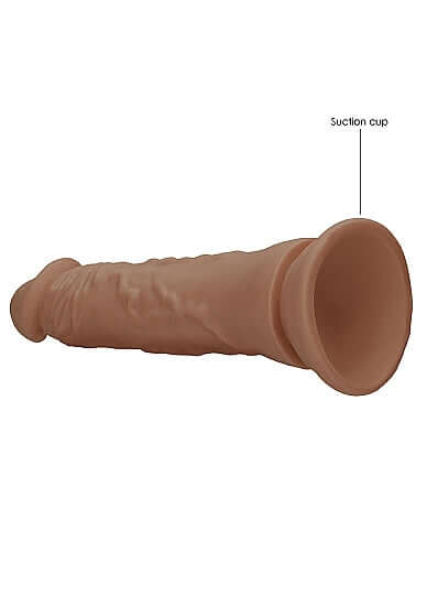 Realrock 7 inches dong in tan medium skin tone featuring a suction cup base for hands-free enjoyment.