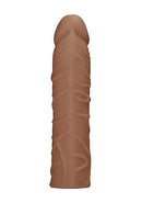 Realrock Penis Sleeve 7 inches in medium skin tone, lifelike design with realistic textures, body-safe TPE material.