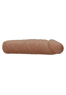 Realrock Penis Sleeve 7 inches in medium skin tone with realistic textures and lifelike shape, made from body-safe, phthalate-free TPE.